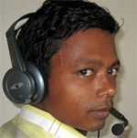 Opino Gamango wearing a headset at a recording session